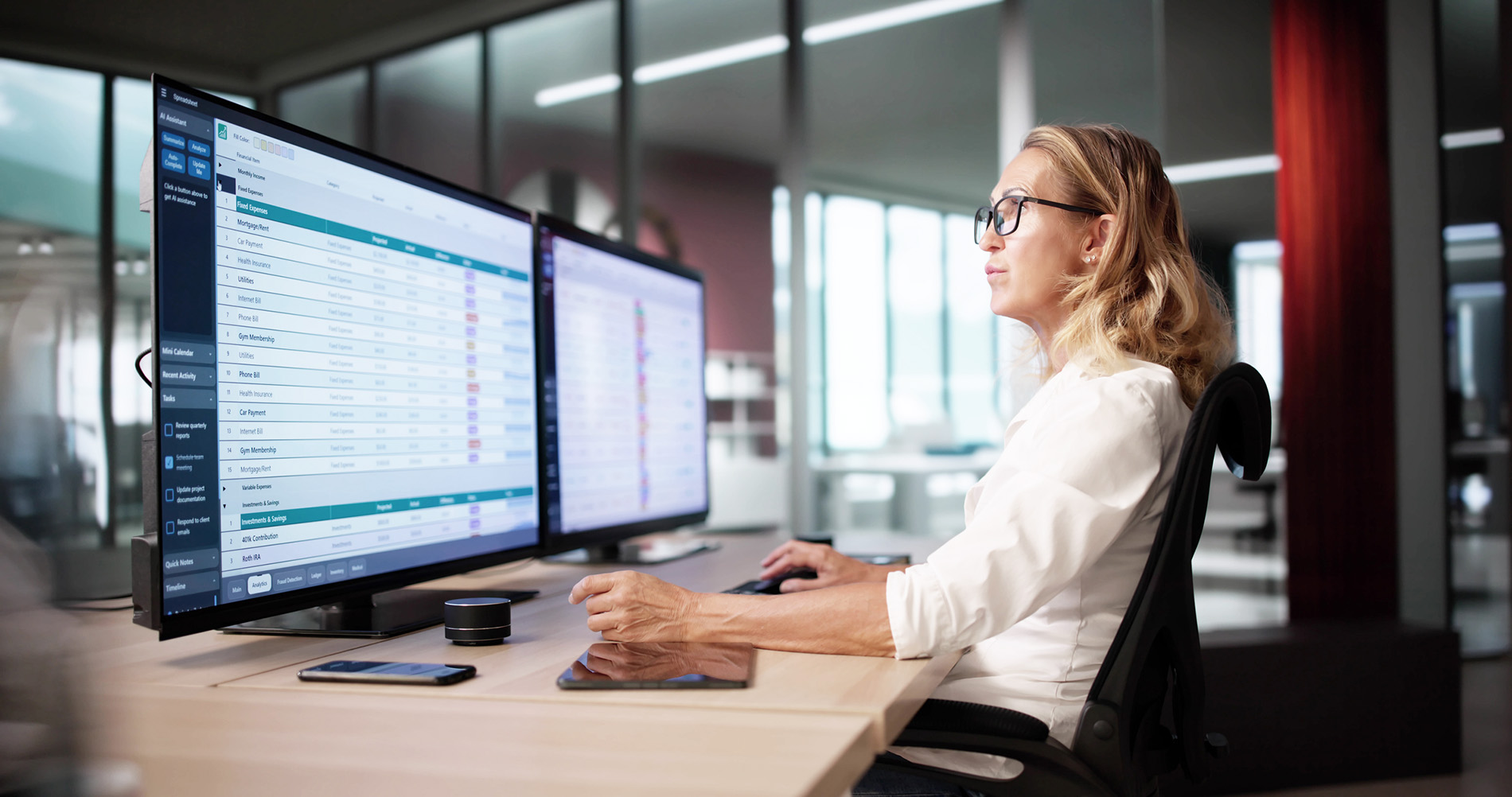 Woman in front of two monitors